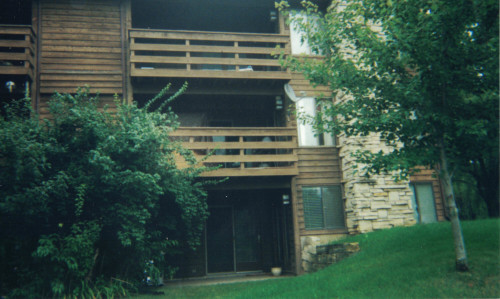 Before photo of a 3-story high entryway needing work done.