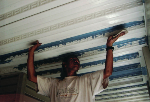 Photo of sanding out the last rough spots of the ceiling.