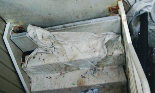 Photo of painter's cloth over the concrete stairs at jobsite.