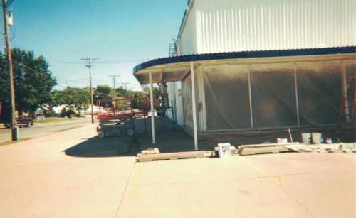 Before photo of an old shop's front exterior in need of care.