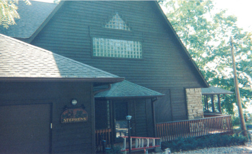 Before photo of a beautiful handmade home beginning to weather.