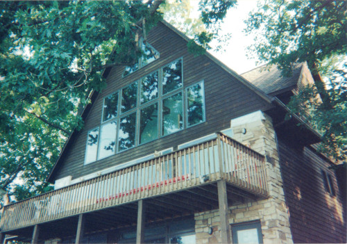 Before photo of some uneven color on the home's exterior.